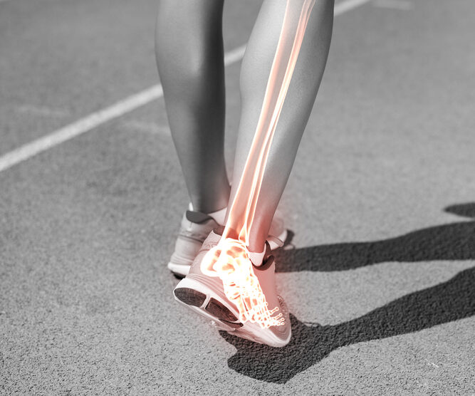 Low,Section,Of,Female,Athlete,Walking,On,Track,During,Sunny