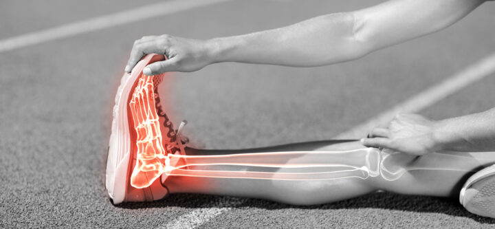 Low,Section,Of,Sportswoman,Stretching,On,Sports,Track,During,Sunny